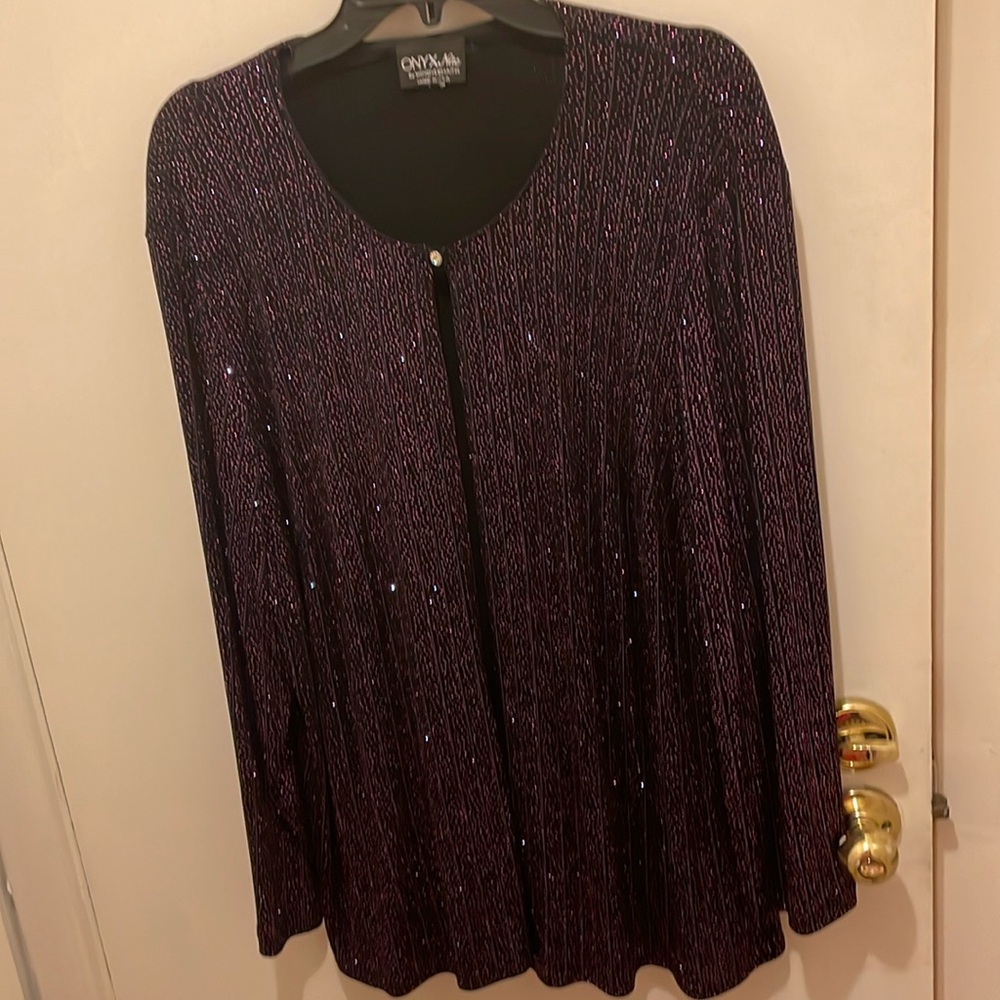A luxurious sparkling top to ware formal. Deep purple with sparkling.